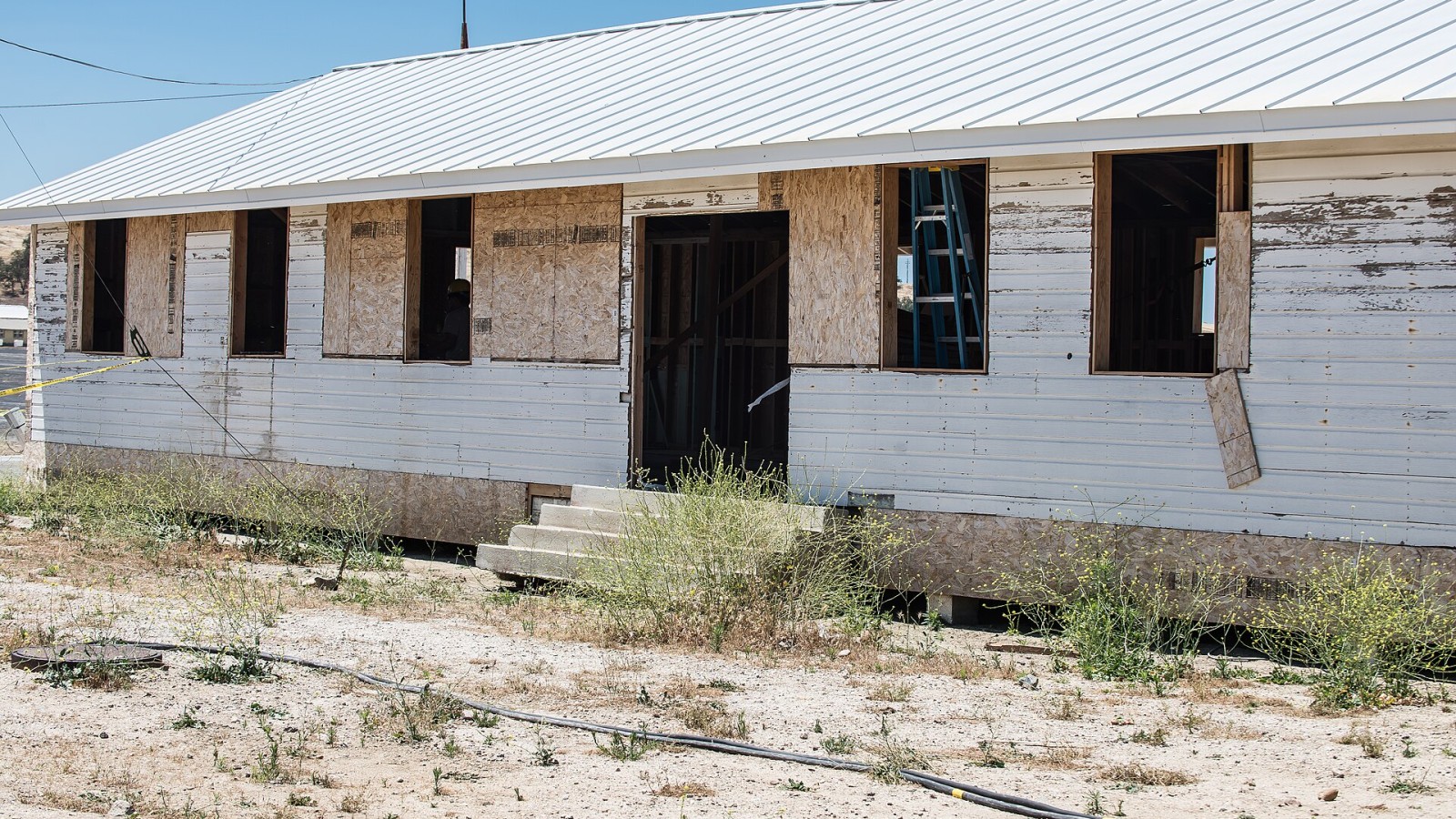 A World War II era building waits as the 315th Engineer Vertical Construction Company prepares its renovations at Camp Roberts, Calif., May 16. The California National Guard unit has been tasked to renovate buildings ori