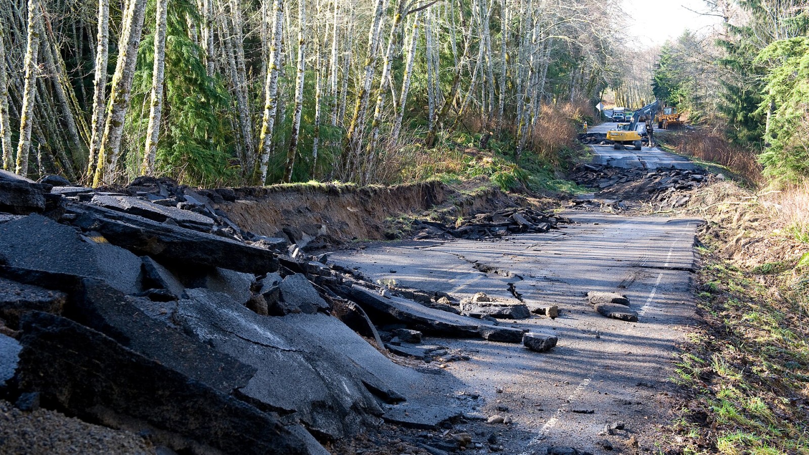 Sekiu, WA, March 2, 2009 -- Winding along The Straight of Juan De Fuca, State Route 112 suffered severe damage after flooding eroded the highway. WA DOT crews work to repair the roadway after the storms wake and reopen t
