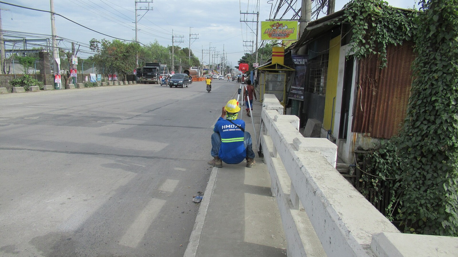 New Labangan Bridge 2 Surveyors using Leica Geosystems GST20 (TS15) Total Station on tripods and Prism Constant GPR111 at Calumpit railway station construction sites Calumpit station - Calumpit railway station constructi