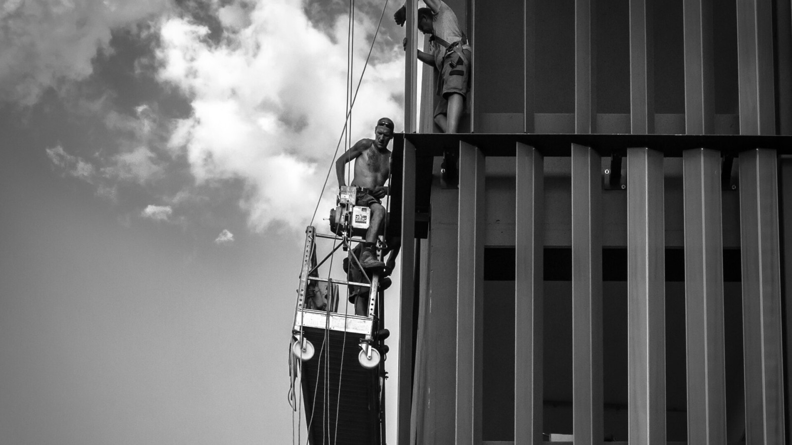500px provided description: 3 workes finishing the park'n ride building in Spittelau. [#street ,#adult ,#man ,#white ,#black ,#male ,#men ,#Sky ,#Wien ,#Work ,#Mensch ,#Stra?e ,#Working ,#Construction Site ,#Spittelau]