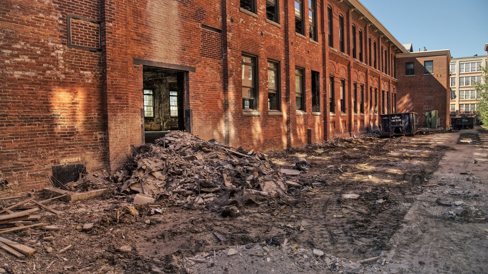 Exterior capture of a commercial office building being gutted for construction