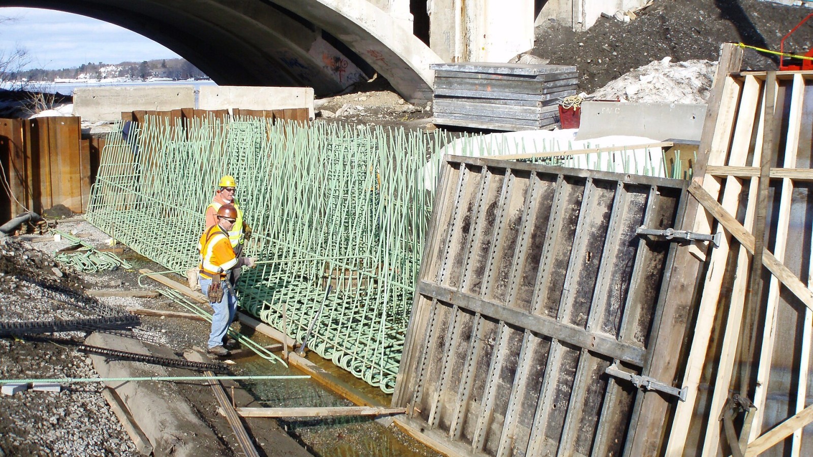 In Worcester, at the Burns Bridge construction site, pier 1, workers are forming and reinforcing the pier cap. Construction continues on the replacement of the Kenneth F. Burns Memorial Bridge, a signature initiative of