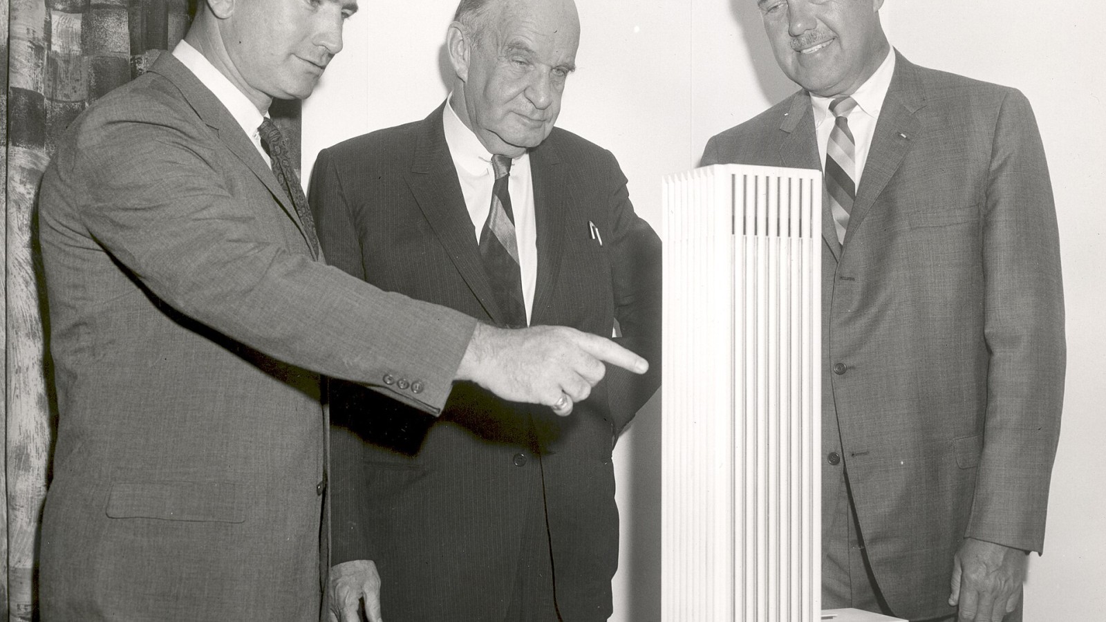 Model of Electronics Research Centers first phase of construction is examined by (from left) Dr. Albert J. Kelley, Deputy Director; Edward Durell Stone, architect, of the joint venture team which designed the facilities;