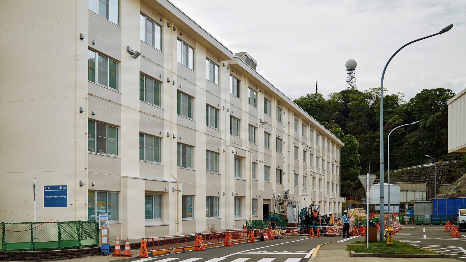 FLEET ACTIVITIES YOKOSUKA, Japan (April 15, 2026) -- A view of Unaccompanied Housing Building 1530's exterior renovations after scaffolding was removed as crews move to underground utilities April 15, 2026. Major mechani