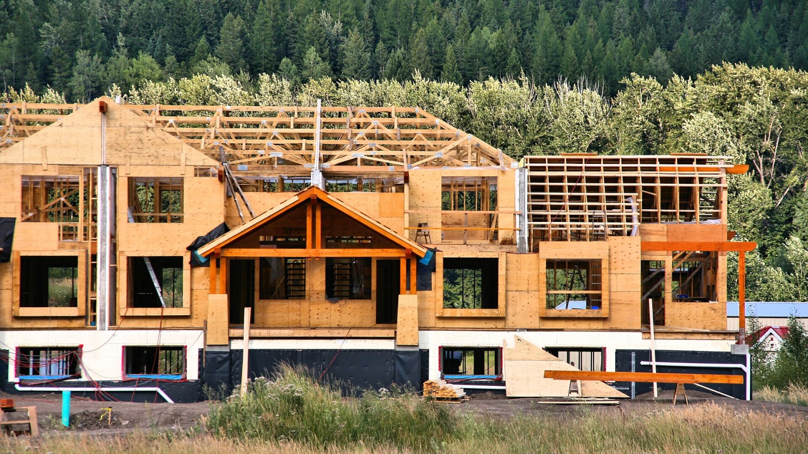 Wood frame condominium construction in Canada. Apartment building with wooden framework, construction site in Fernie, British Columbia.