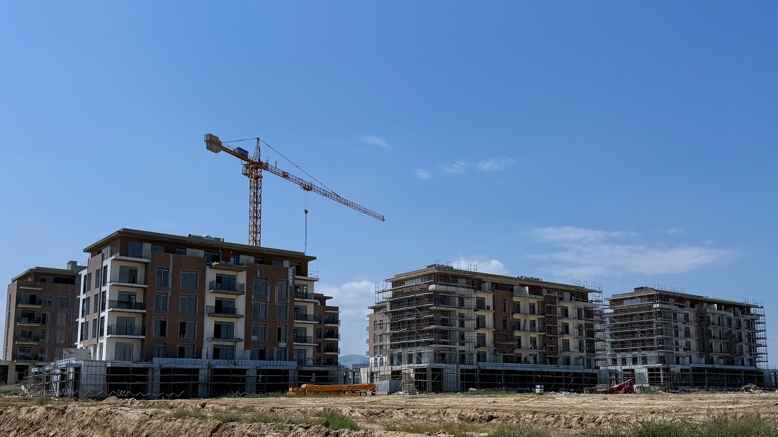 Residential buildings under construction in the city of Ağdam, Azerbaijan, reflecting the city's ongoing reconstruction.