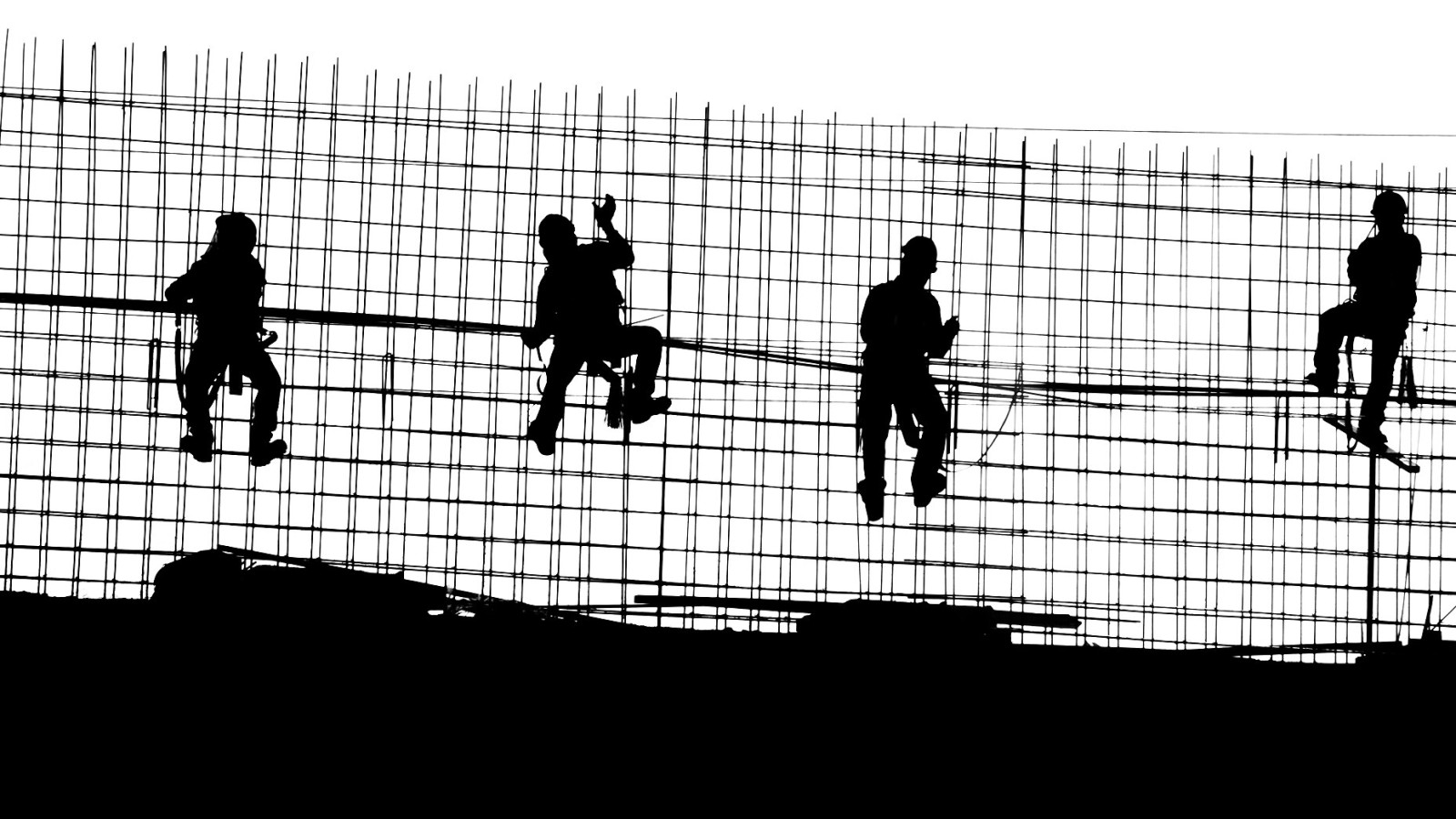 Construction workers in Mexico preparing concrete structure.