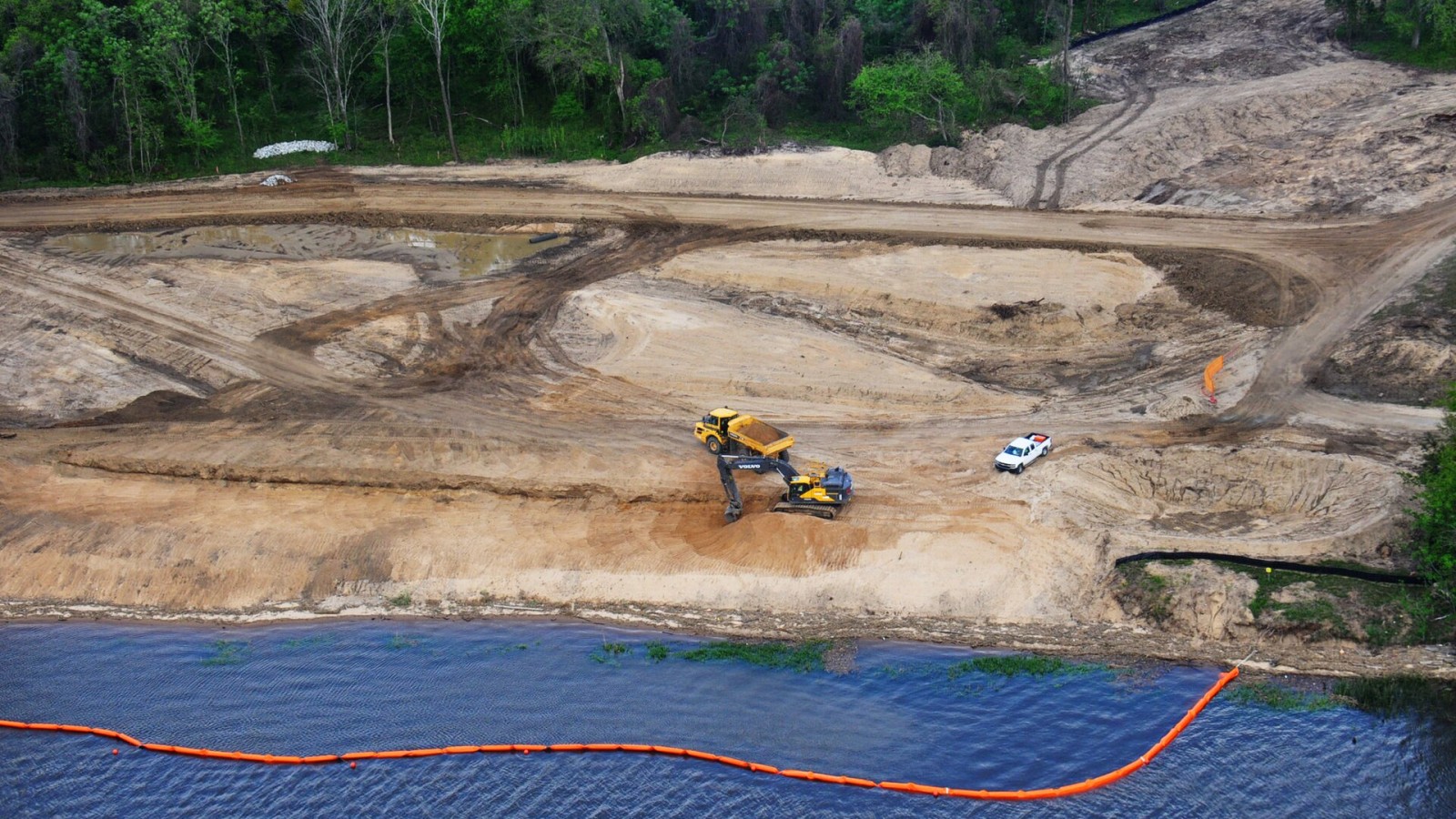 A contractor clears and prepares a site on Hutchinson Island, Savannah, Georgia, to construct a dissolved oxygen injection system. The DO injection system, consisting of a series of Speece cones, will remove water from t