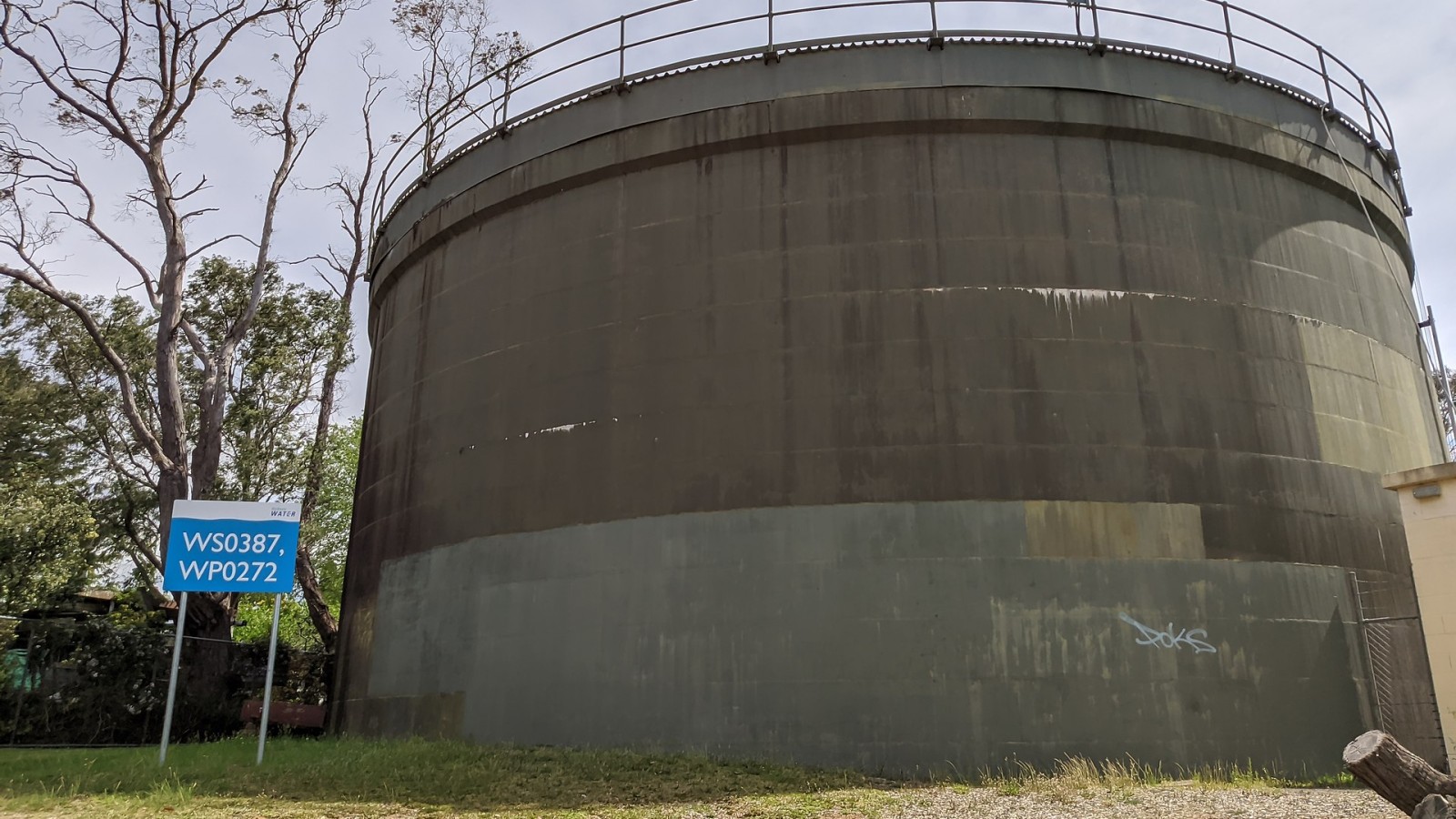 A covered reservoir in Bullaburra, NSW Australia on Great Western Highway (reference number WS0387). The facility is operated by Sydney Water and the grounds also service a pumping station.