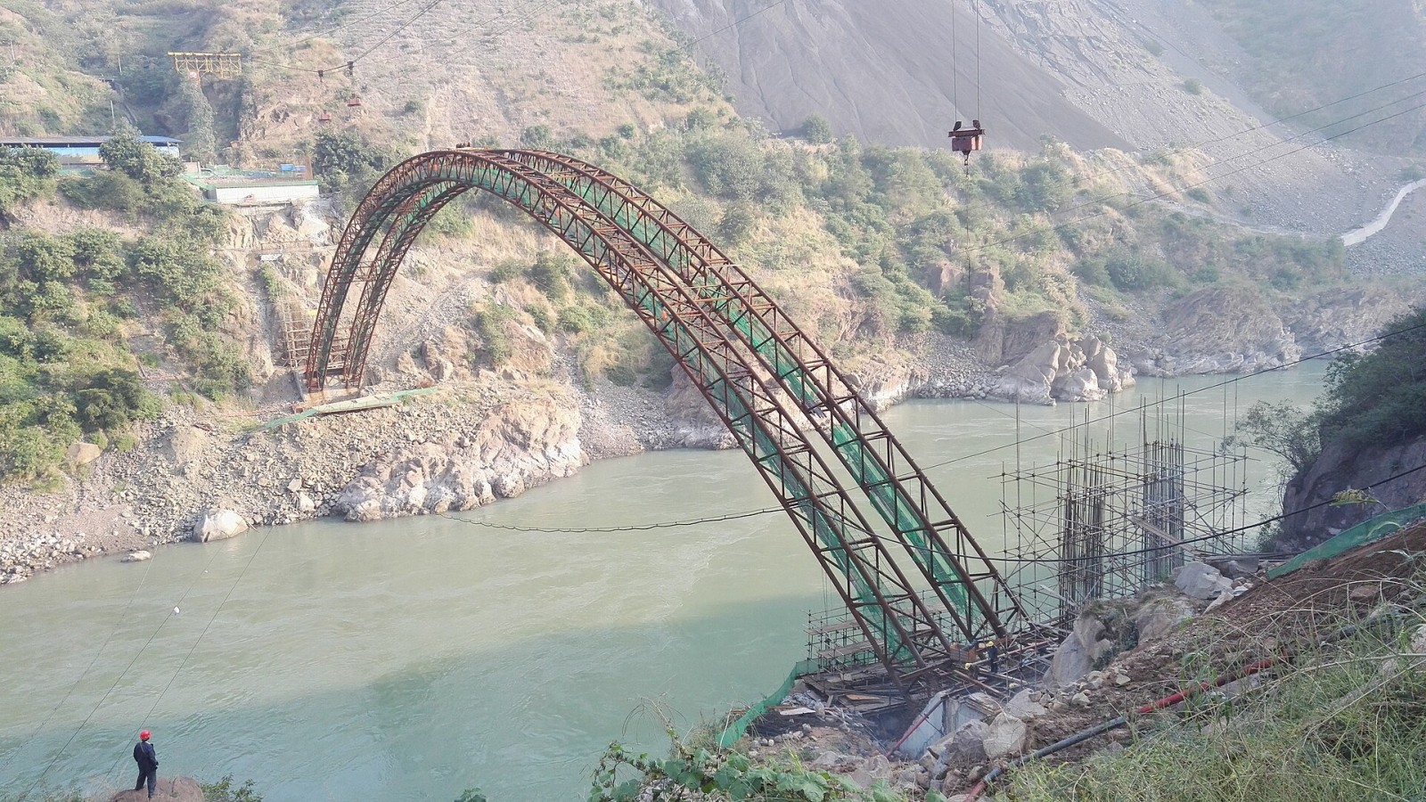 Pipeline Bridge 503 (503管桥) under construction over Jinsha River. It is a part of the Guanyinyan water diversion project. The bridge got its name from a nearby fossil fuel power plant named "Power Plant 503" which is und