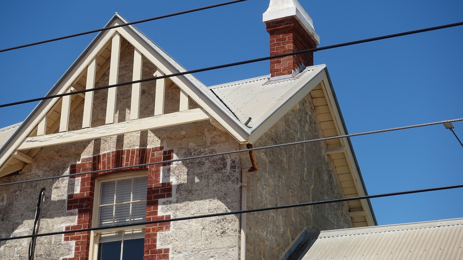 The old station building at Claremont in Perth, Western Australia, with a rusting downpipe due to an unusual construction of the roof and gutter.