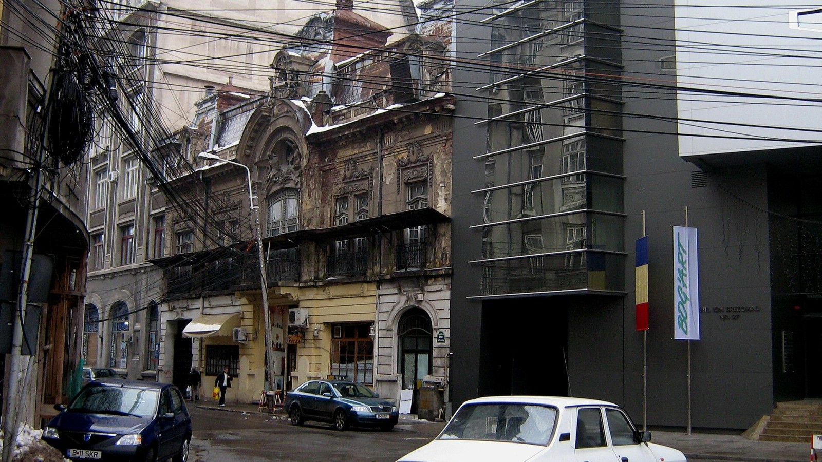 The following is the author's description of the photograph quoted directly from the photograph's Flickr page."I suppose they're waiting for the builing to become beyond repair.Then, they'll come up with a memo and some