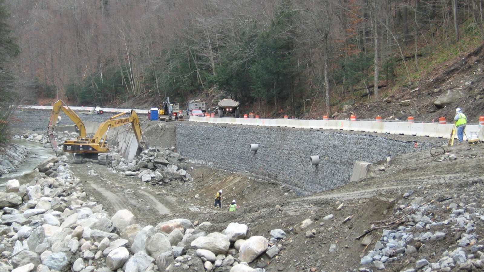 Significant progress is seen in retaining wall reconstruction on Route 2. The road is closed from Mile Marker 21.6 in Florida to Mile Marker 27.5 in Charlemont, with damage including severe slope failures, roadway underm