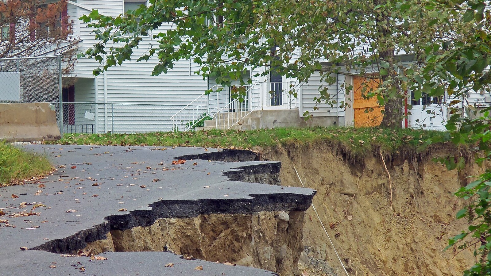 Damage to Butternut Drive, a residential street in New Windsor, NY, USA, caused when nearby Moodna Creek flooded after Hurricane Irene