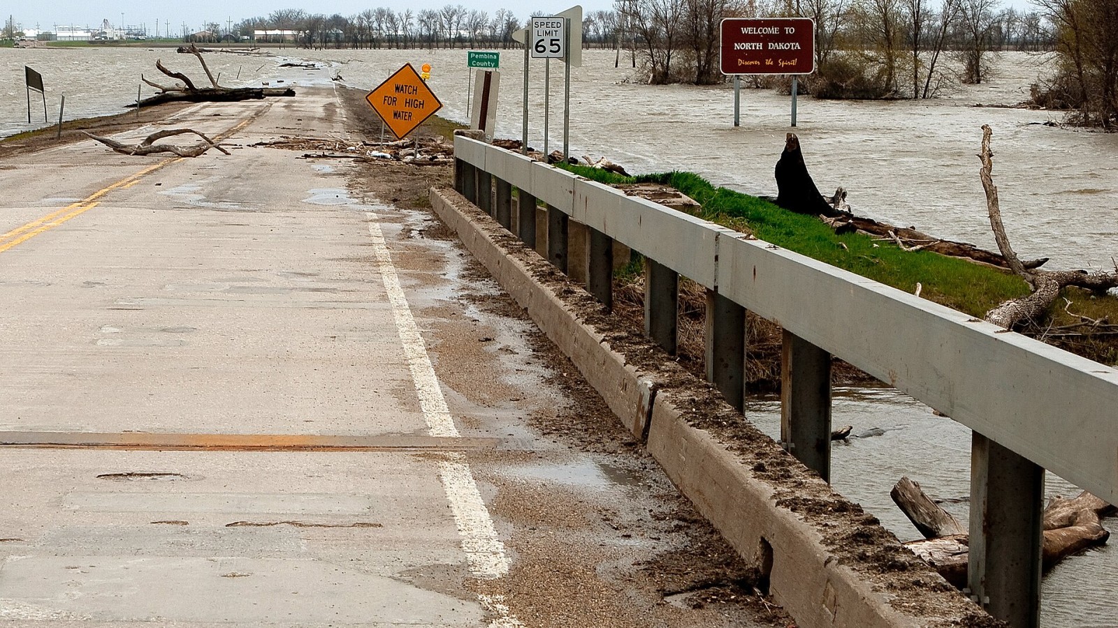 Oslo, MN, May 14, 2009 -- 35 days after the Red River flooded, the damage is still dramatic. FEMA Public Assistance money helps states and governments rebuild public infrastructure such as this bridge. Photo by Ed Edahl/