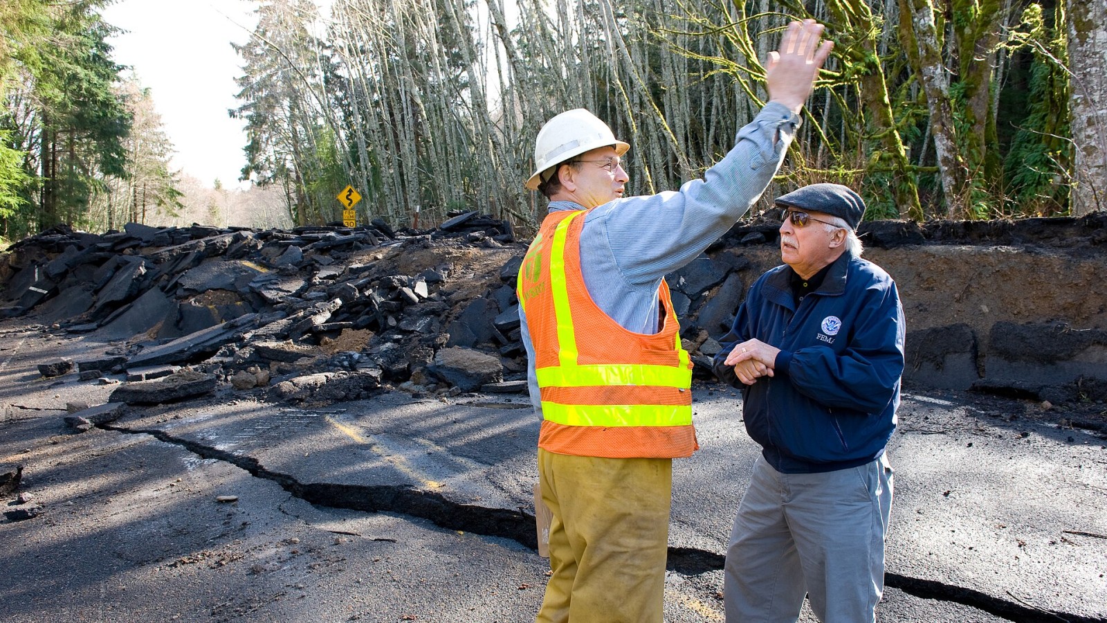 Sekiu, WA, March 2, 2009 -- Along The Strait of Juan De Fuca, FEMA Public Information Officer (PIO) Ernie Martz and WA DOT supervisor Bill "Hallelujah" White discuss recent flood levels during a damage survey to State Ro