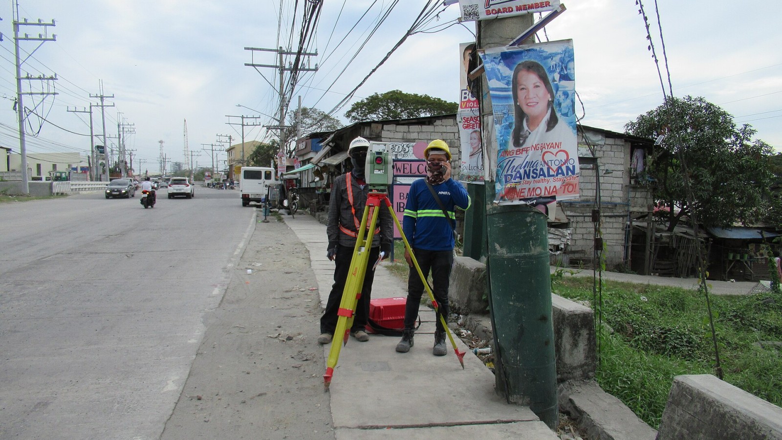 Surveyors using Leica Geosystems GST20 (TS15) Total Station on tripods and Prism Constant GPR111 at Calumpit railway station construction sites Calumpit station - Calumpit railway station construction sites (Iba O'Este)