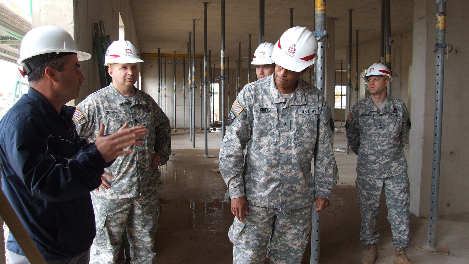 Frank Varano, left, local project manager for Defense Health Agency-Europe, leads Brig. Gen. Norvell V. Coots, commander of Europe Regional Medical Command, on a site visit Sept. 3 of the new health and dental clinic und