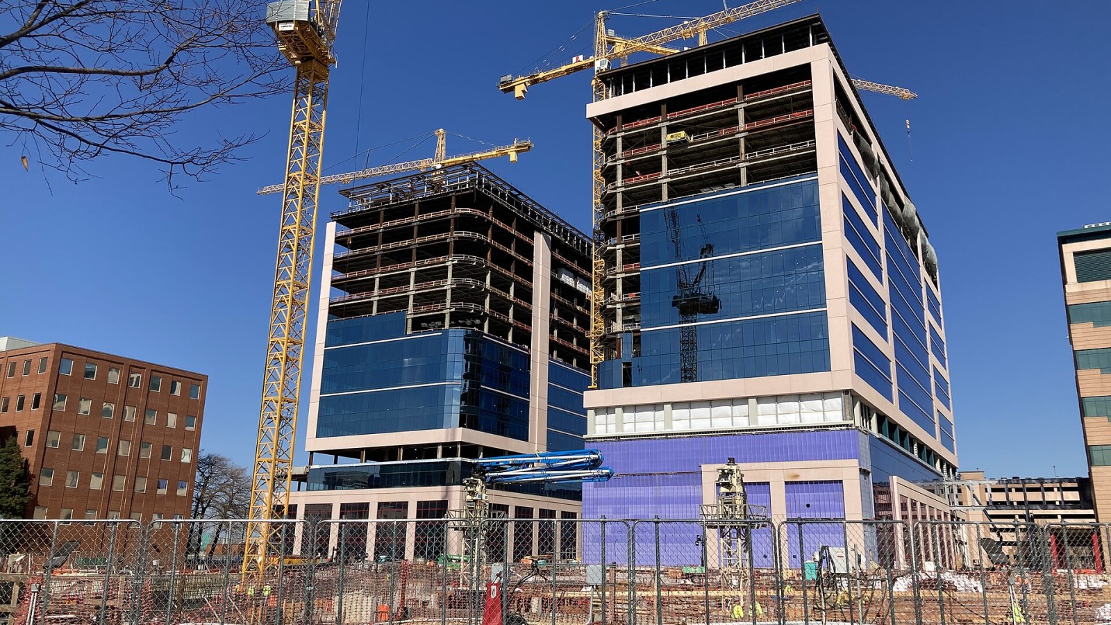The future Clinical Office Building (256 feet tall, on left) and Outpatient Clinic Building (265 feet tall) under construction at St. Jude Children’s Research Hospital in January 2025. Once completed, the 15-story towers