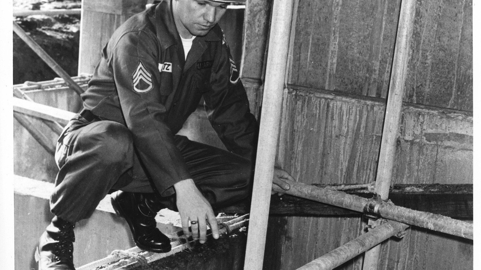 Release Number: 5-16/mf For Immediate Release: Far East Engineers Help Build a Better Tomorrow Seoul, Korea (U.S. Forces Korea) -- SSgt Donald R. Lotz inspects a scaffold for safety at the Kishine Barracks construction s