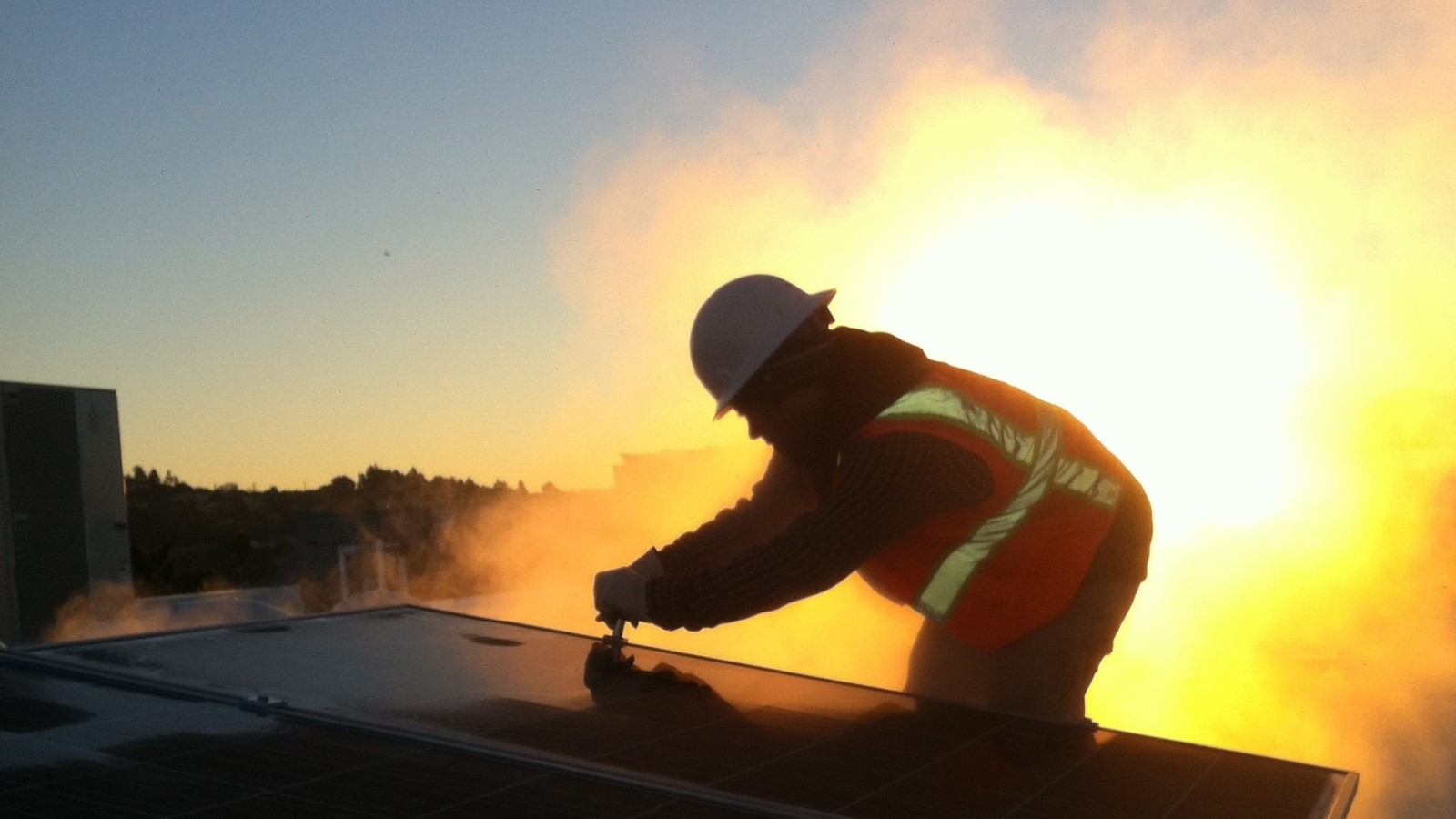 Solar Installer Sage with Sustainable Technologies installing a rooftop 36kW Electrical PV Installation for Reach Ashland Youth Center, a LEED Platinum Certified building in Alameda County.
