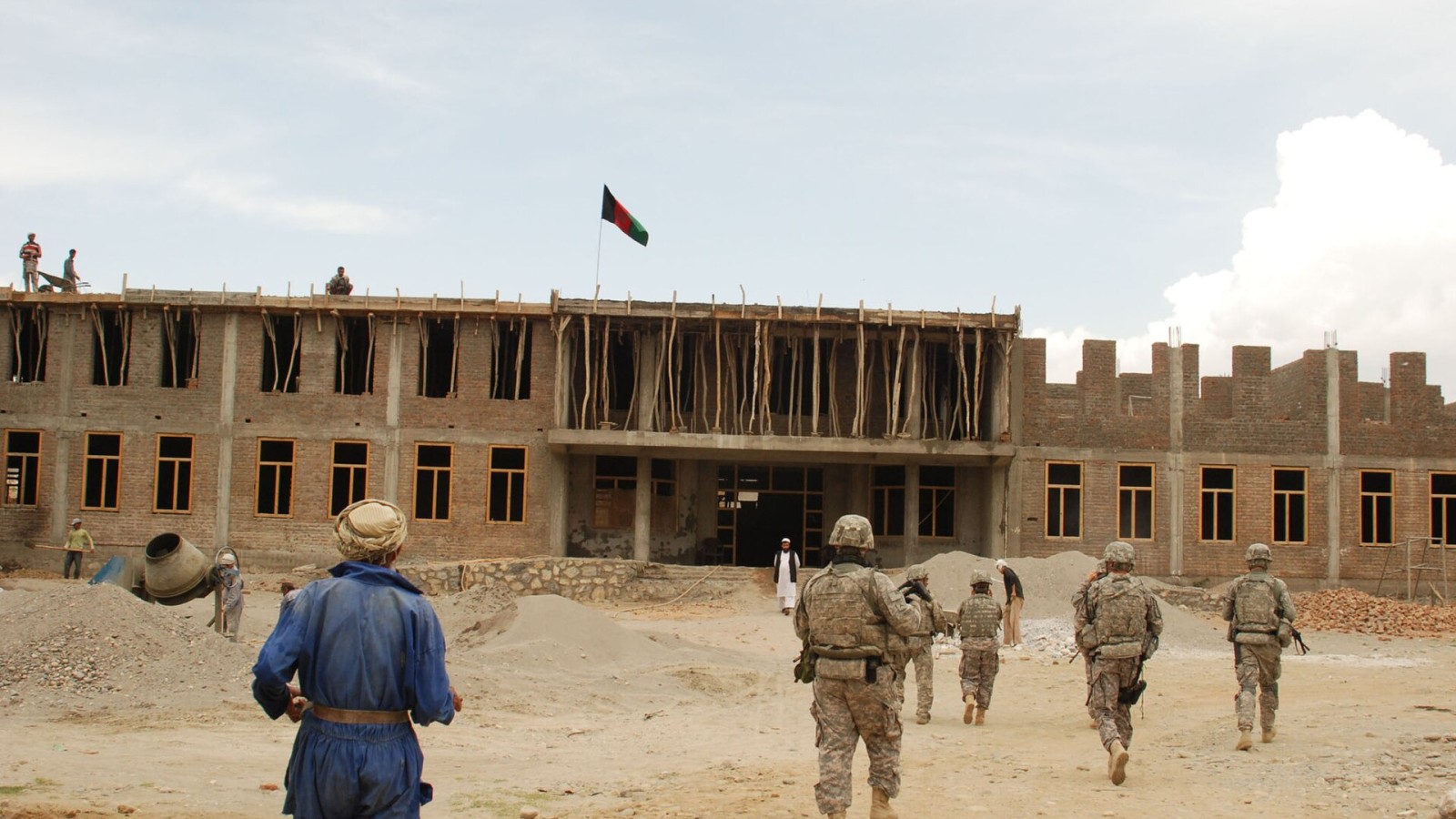 Members of the Kapisa Provincial Reconstruction Team inspect Masaab high school, a project under construction in Kapisa province, Sept. 16. PRTs assist Afghans in the construction of key infrastructure including, schools