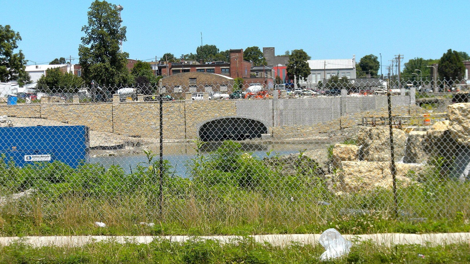 Construction site on NW corner Springfield Ave. and 2nd St. Champaign, Illinois, site of the NRHP Stone Arch Bridge (since May 14, 1981). It's not clear what exactly is happening here. The new bridge shown here is much b
