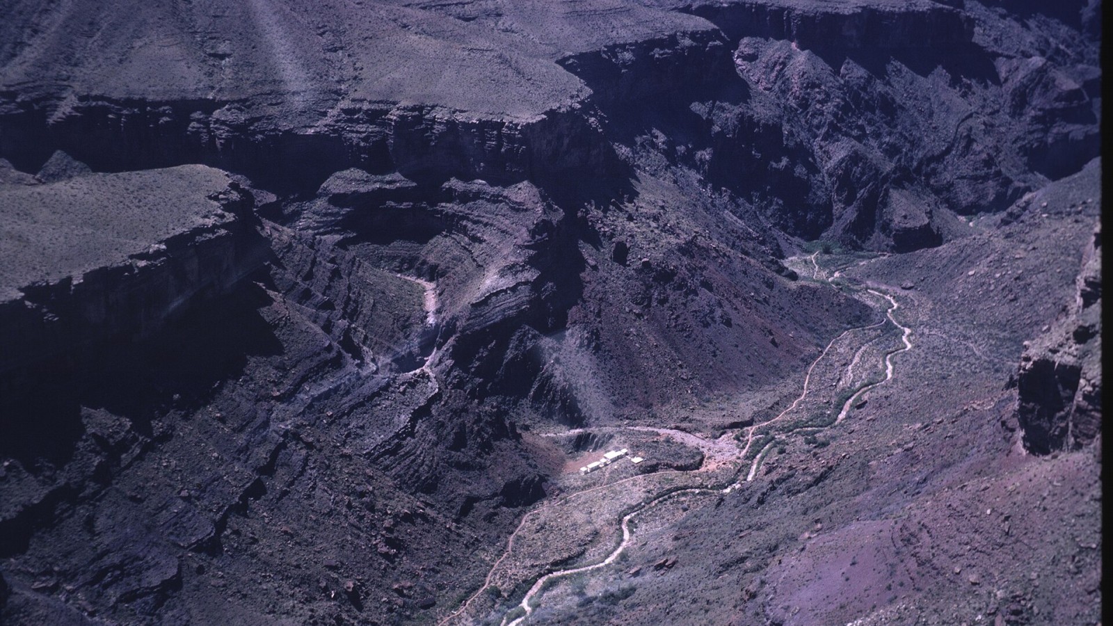 Aerial view of work camp along the North Kaibab Trail in the vicinity of Ribbon Falls during the construction of the Trans-canyon Pipeline (historic) NPS Photo by Dan Cockrum. Circa 1965. GRCA 81008