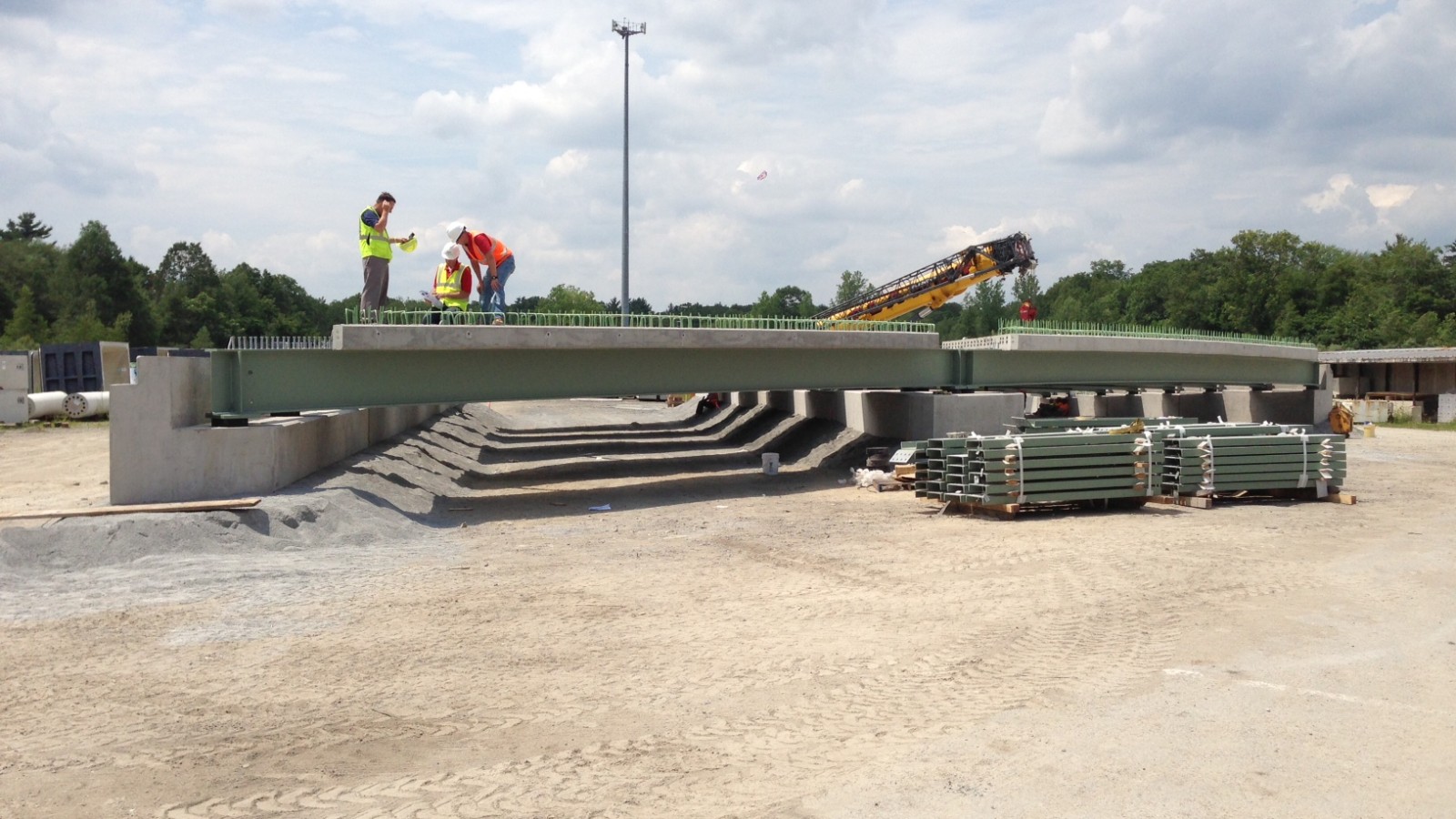 MassDOT engineers are test fitting a prefabricated bridge at the factory in Rehoboth, Massachusetts. The bridge will be installed on Revere Beach Parkway over the MBTA Blue Line later in 2013.
