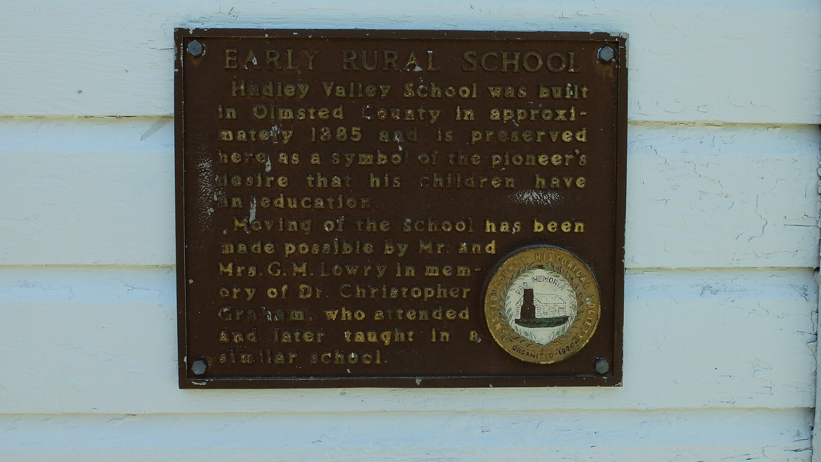 Historic marker at the Hadley Valley Schoolhouse, built in 1885. Now a museum moved to the History Center of Olmsted County's campus in 1975. Rochester, Minnesota, United States.