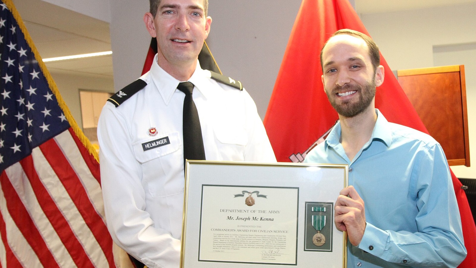 Joseph McKenna, a Europe District architect, receives the Commander’s Award for Civilian Service from Col. Peter Helmlinger, district commander, during a ceremony Oct. 11 at the Amelia Earhart Center in Wiesbaden, German