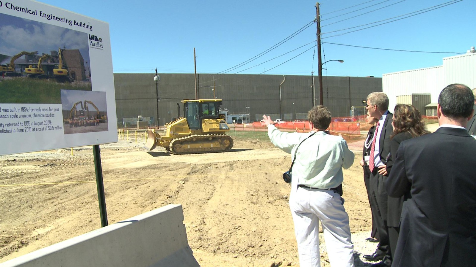 LATA/Parallax Portsmouth Project Manager Linda Bauer points out to Deputy Secretary Poneman the site where the X-760 Chemical Engineering Building once stood at the Portsmouth Site. Demolition of the 8,000 square foot st