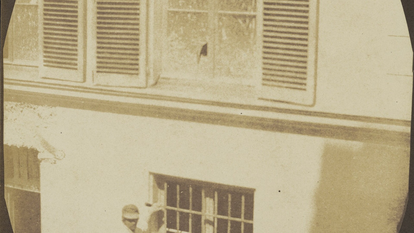 A construction worker stands below eye-level amidst the geometric structure of a two-story building. This photographic view of daily life in the 1840s was quite unusual, demonstrating Hippolyte Bayard's early interest in